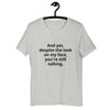 "And yet, despite the look on my face, you're still talking." - T-shirt, unisex (DT)